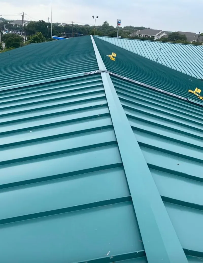 Green commercial metal roof ridge and valley for Metal Roof Repair in Laconia